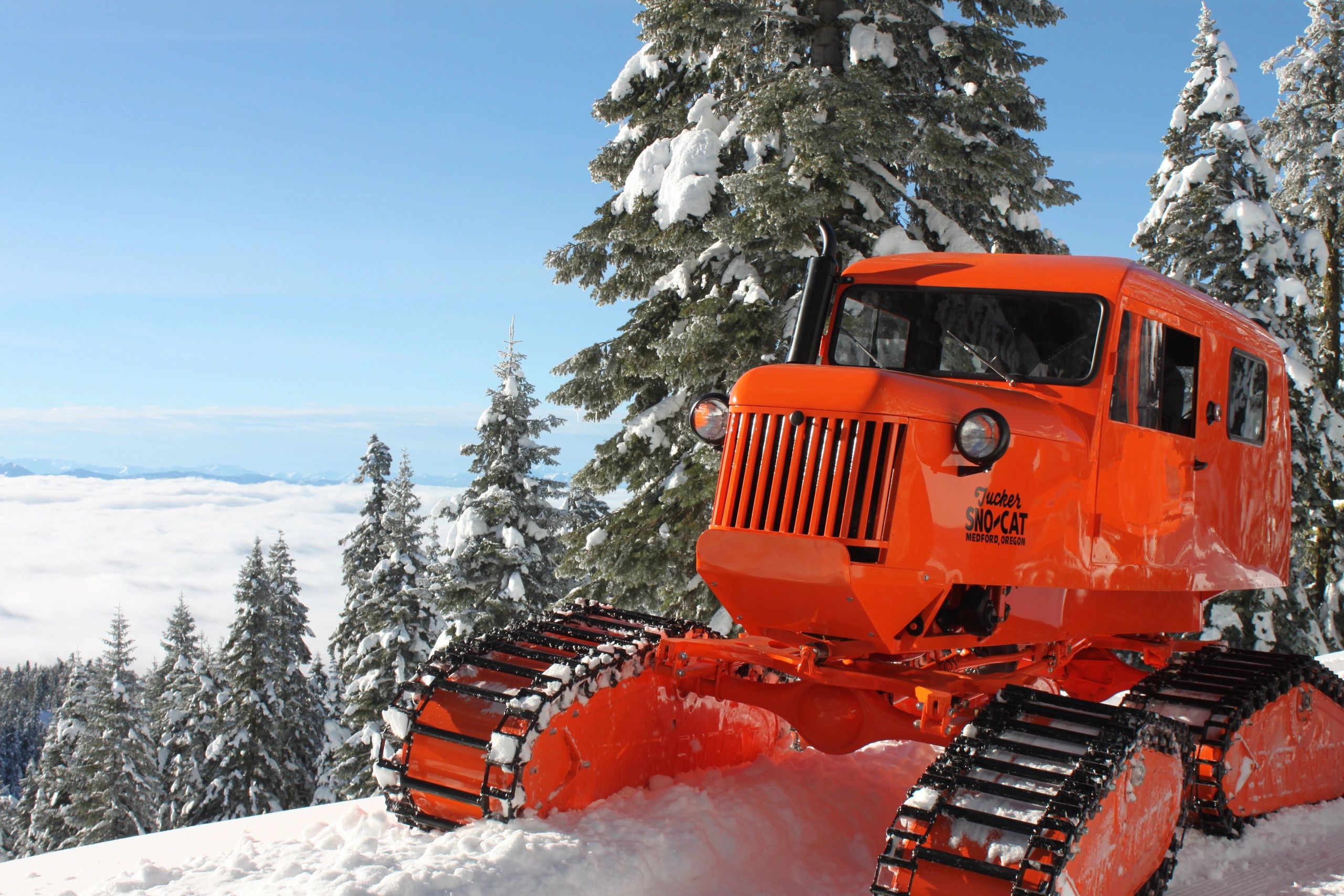 Vintage Tucker Sno-Cat vehicle on a snowy mountain